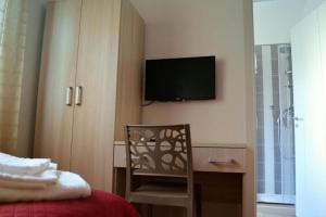 TV a/nebo společenská místnost v ubytování B&B Benvenuti al Sud
