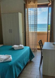 Postel nebo postele na pokoji v ubytování B&B Benvenuti al Sud