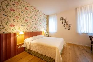 Postel nebo postele na pokoji v ubytování Albergo del Cuore