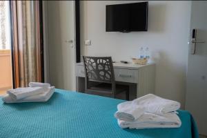 Postel nebo postele na pokoji v ubytování B&B Benvenuti al Sud