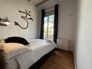 Ένα ή περισσότερα κρεβάτια σε δωμάτιο στο MODERN FLAT POBLE NOU