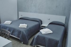 Postel nebo postele na pokoji v ubytování B&B Benvenuti al Sud