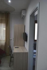 TV a/nebo společenská místnost v ubytování B&B Benvenuti al Sud