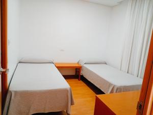 Postel nebo postele na pokoji v ubytování Torrejoven