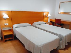 Postel nebo postele na pokoji v ubytování Torrejoven