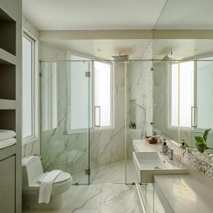 a bathroom with a shower and a toilet and a sink at A Dream Hua Hin - Beachfront Retreat in HHQ