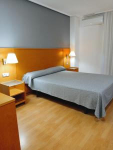 Postel nebo postele na pokoji v ubytování Torrejoven
