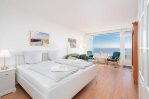Postel nebo postele na pokoji v ubytování Ferienwohnung Meerblick App 805