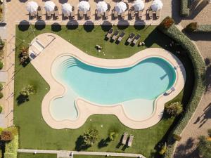 an overhead view of a swimming pool in a resort at ReBi Village in Imperia