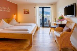 Postel nebo postele na pokoji v ubytování Main-Vinotel Weingut Helmstetter