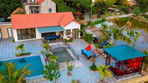 an aerial view of a house with a swimming pool at Tam Coc Minh Quan Homestay in Ninh Binh