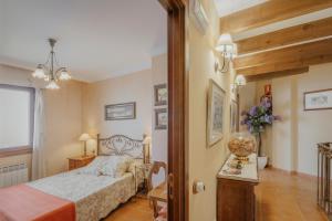 a bedroom with a bed and a table with a lamp at La Panera in Castrojimeno