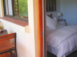 Ένα ή περισσότερα κρεβάτια σε δωμάτιο στο Cedar Lodge Guest House