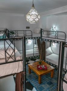 Postel nebo postele na pokoji v ubytování Hostel Amour d'auberge