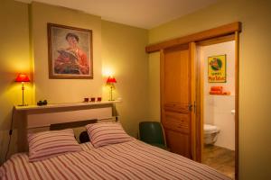 Postel nebo postele na pokoji v ubytování B&B Chez tante Alice