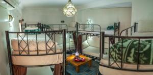 Postel nebo postele na pokoji v ubytování Hostel Amour d'auberge