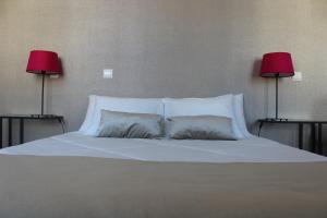 Uma cama ou camas num quarto em Domus 26 Guesthouse - B&B
