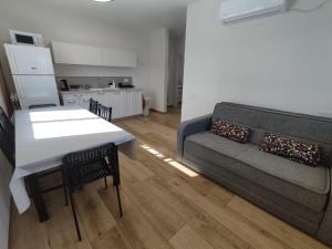 a living room with a couch and a table at מעבר לקשת in Keshet