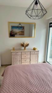 Postel nebo postele na pokoji v ubytování Słoneczne Apartamenty VIKI