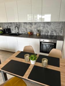 Kuchyň nebo kuchyňský kout v ubytování Słoneczne Apartamenty VIKI + 9 fotografií