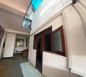 a building with a door on the side of it at Aromin Ayurvedic Palace in Weligama