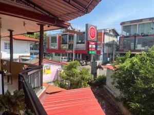 a balcony of a building with a red deck at Aromin Ayurvedic Palace in Weligama
