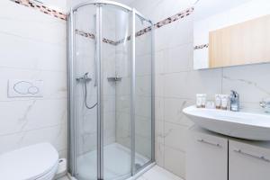 a bathroom with a shower and a toilet and a sink at Ski Paradise SP 008 - MOUNTAIN & LUXE apartment 4 pers in Veysonnaz