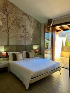 Postel nebo postele na pokoji v ubytování Hotel Ulivi