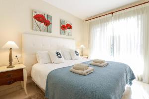 Postel nebo postele na pokoji v ubytování San Pedro beachside apartment