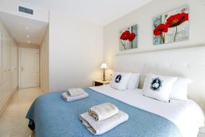 Postel nebo postele na pokoji v ubytování San Pedro beachside apartment