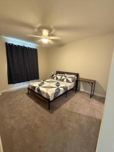 a bedroom with a bed and a ceiling fan at Peaceful 1BHK Escape in Cedar Park, Austin in Cedar Park