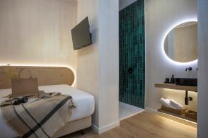 Postel nebo postele na pokoji v ubytování Nomad Haux Mestalla Room 101