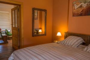 Postel nebo postele na pokoji v ubytování B&B Chez tante Alice