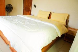 Voodi või voodid majutusasutuse The Vista Homes Kibagabaga toas