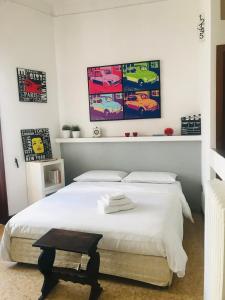 a bedroom with a bed and a painting on the wall at Donna Franca in Lecce