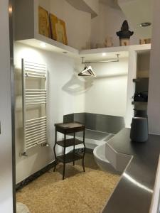 a bathroom with a table and a toilet in it at Donna Franca in Lecce +24 photos