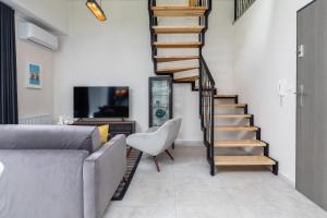 TV a/nebo společenská místnost v ubytování Coast Apartment Close to the Beach with Parking & Balcony by Noclegi Renters