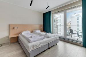 Posteľ alebo postele v izbe v ubytovaní Apartments Old Town Angielska Grobla & by Noclegi Renters