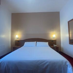 Postel nebo postele na pokoji v ubytování Vald Hotel