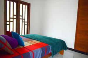 Ένα ή περισσότερα κρεβάτια σε δωμάτιο στο Jungle View Inn