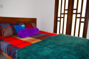 Ένα ή περισσότερα κρεβάτια σε δωμάτιο στο Jungle View Inn