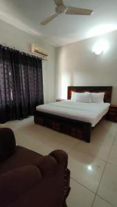 Postel nebo postele na pokoji v ubytování Sunrise Guest House F-6