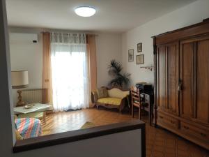 a living room with a couch and a window at Casa Manu Affittacamere in Arezzo