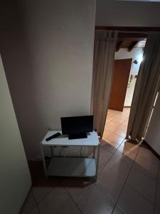 a laptop computer sitting on a table in a room at Dante 10 Flat in Cremona