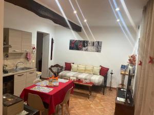 a living room with a table and a couch at La casa del Borgo Anagni in Anagni