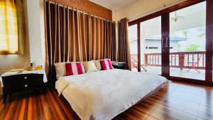 Postel nebo postele na pokoji v ubytování Baan Bhuwann Holiday Apartment
