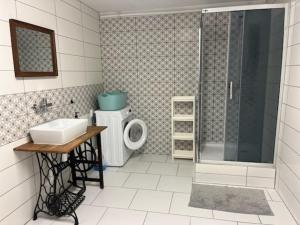 a bathroom with a shower and a sink and a toilet at Górska Kryjówka in Nowy Targ