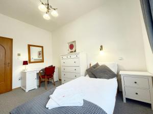 Postel nebo postele na pokoji v ubytování Apartmány Aurelius