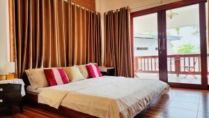 Postel nebo postele na pokoji v ubytování Baan Bhuwann Holiday Apartment