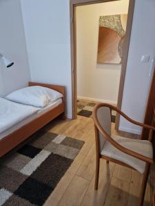 Postel nebo postele na pokoji v ubytování Apartmány Aurelius
